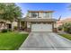 Charming two-story home boasting a two-car garage, inviting front porch, and well-kept lawn at 3466 E Bruce Ave, Gilbert, AZ 85234