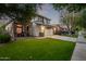 Inviting two-story home with a well-manicured lawn, driveway, and two-car garage at 3466 E Bruce Ave, Gilbert, AZ 85234