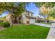 Beautiful two-story home with a manicured lawn, driveway, and two-car garage at 3466 E Bruce Ave, Gilbert, AZ 85234