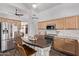 A modern kitchen with stainless steel appliances, light wood cabinets, and a decorative kitchen island at 3466 E Bruce Ave, Gilbert, AZ 85234