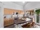 Bright kitchen featuring wood cabinets, stainless steel appliances, and a unique center island with seating at 3466 E Bruce Ave, Gilbert, AZ 85234