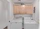 The laundry room features neutral cabinets and modern washer and dryer units at 3466 E Bruce Ave, Gilbert, AZ 85234