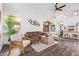Stylish living room with modern furniture, wood floors, and plenty of natural light at 3466 E Bruce Ave, Gilbert, AZ 85234