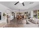 Spacious floor plan with kitchen, dining, and living areas with stylish wood flooring throughout at 3466 E Bruce Ave, Gilbert, AZ 85234