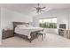 A bright and spacious main bedroom featuring a ceiling fan and a large window at 3466 E Bruce Ave, Gilbert, AZ 85234