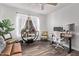 Comfortable home office setup with a desk, chair, and ample lighting at 3466 E Bruce Ave, Gilbert, AZ 85234