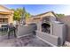 Outdoor fireplace with a stone surround, providing a cozy and inviting atmosphere for gatherings at 3466 E Bruce Ave, Gilbert, AZ 85234