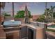 Outdoor kitchen featuring a built-in grill, countertop space, and ample storage for alfresco dining at 3466 E Bruce Ave, Gilbert, AZ 85234