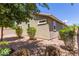 A pleasant backyard featuring desert landscaping and shrubs surrounds this home's exterior at 3507 E Alfalfa Dr, Gilbert, AZ 85298