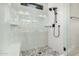 Modern bathroom featuring a walk-in shower with beautiful hexagon tile floor and black hardware at 3507 E Alfalfa Dr, Gilbert, AZ 85298