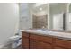Bathroom showcasing vanity with sink, toilet and shower with tiled walls at 3507 E Alfalfa Dr, Gilbert, AZ 85298