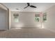 Bright and airy bedroom showcasing neutral walls, carpet flooring, multiple windows, and ample space at 3507 E Alfalfa Dr, Gilbert, AZ 85298