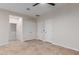 Neutral bedroom with tile floors, ceiling fan, closet and door to another room at 3507 E Alfalfa Dr, Gilbert, AZ 85298