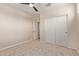 Bedroom featuring neutral carpet, ceiling fan, and double door closet at 3507 E Alfalfa Dr, Gilbert, AZ 85298