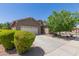 Inviting single-level home with a well-maintained front yard and a spacious driveway leading to the garage at 3507 E Alfalfa Dr, Gilbert, AZ 85298