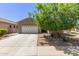 Charming single-story home featuring a two-car garage, desert landscaping, and a welcoming entrance at 3507 E Alfalfa Dr, Gilbert, AZ 85298