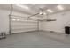 Spacious two car garage with painted floor and overhead storage at 3507 E Alfalfa Dr, Gilbert, AZ 85298