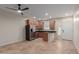 Bright kitchen features stainless steel appliances, tile floors, granite countertops, and wooden cabinets at 3507 E Alfalfa Dr, Gilbert, AZ 85298