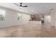 Inviting living area with a view of the kitchen, tile flooring, neutral decor, and natural light from the windows at 3507 E Alfalfa Dr, Gilbert, AZ 85298
