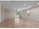Open-concept living room featuring neutral walls, tile flooring, recessed lighting, and a sliding glass door to the outside at 3507 E Alfalfa Dr, Gilbert, AZ 85298