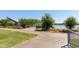 Sidewalk through a community park with green space and a lake at 3507 E Alfalfa Dr, Gilbert, AZ 85298