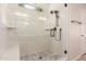 Modern bathroom featuring a walk-in shower with glass doors and tiled walls at 3507 E Alfalfa Dr, Gilbert, AZ 85298