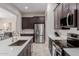 Modern kitchen featuring stainless steel appliances, ample counter space, and stylish lighting at 3852 E Bartlett Way, Chandler, AZ 85249