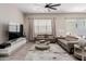 Comfortable living room featuring two couches, a large TV, and a modern coffee table at 3852 E Bartlett Way, Chandler, AZ 85249