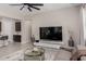 Bright living room with a large TV, modern decor, and an open layout at 3852 E Bartlett Way, Chandler, AZ 85249
