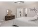 Spacious main bedroom featuring neutral tones, plush carpeting, and modern furnishings at 3852 E Bartlett Way, Chandler, AZ 85249