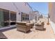Inviting outdoor patio space featuring cushioned seating and string lights at 3852 E Bartlett Way, Chandler, AZ 85249