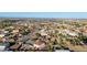 Expansive aerial view of a desert neighborhood with single-Gathering homes and mountain views under a clear sky at 3927 E Vista Grande --, San Tan Valley, AZ 85140
