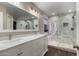 Bathroom boasts double sinks with marble countertops and walk-in shower with marble tiling and dual shower heads at 3927 E Vista Grande --, San Tan Valley, AZ 85140