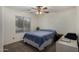 This bedroom is carpeted and has a ceiling fan for added comfort and natural light at 3927 E Vista Grande --, San Tan Valley, AZ 85140
