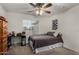 This bedroom features a ceiling fan, a large window, and comfortable carpeted floors at 3927 E Vista Grande --, San Tan Valley, AZ 85140