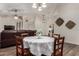 Dining area has a round table with seating for four, plus decorative baskets and a leather sofa at 3927 E Vista Grande --, San Tan Valley, AZ 85140