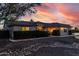 Inviting home showcasing meticulously maintained landscaping, decorative rock beds, and soft exterior lighting at 3927 E Vista Grande --, San Tan Valley, AZ 85140