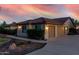 Charming one-story home boasting a well-manicured lawn, lush shrubs, and a welcoming two-car garage at 3927 E Vista Grande --, San Tan Valley, AZ 85140