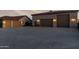 Large multi-car garage with ample parking space and well-lit exterior; perfect for car enthusiasts at 3927 E Vista Grande --, San Tan Valley, AZ 85140