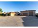 Attached three-car garage with a tile roof, and concrete driveway, situated on a large lot at 3927 E Vista Grande --, San Tan Valley, AZ 85140