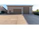Detached three-car garage featuring a tile roof and coach lights at 3927 E Vista Grande --, San Tan Valley, AZ 85140