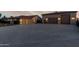 Attached three-car garage with coach lights and detached three-car garage with a large concrete driveway at 3927 E Vista Grande --, San Tan Valley, AZ 85140