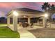 Outdoor gazebo features a tile roof, ceiling fan and lighting, with outdoor chairs around a fire pit at 3927 E Vista Grande --, San Tan Valley, AZ 85140