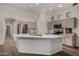 A gourmet kitchen with a large island, stainless steel appliances, and wood-look tile flooring at 3927 E Vista Grande --, San Tan Valley, AZ 85140