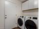 The laundry room includes a washer, dryer and overhead storage at 3927 E Vista Grande --, San Tan Valley, AZ 85140