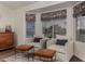 Cozy living room features two armchairs, patterned roman shades, and a wooden cabinet with drinks at 3927 E Vista Grande --, San Tan Valley, AZ 85140