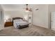 Spacious primary bedroom offers ceiling fan, plush carpet and ensuite access at 3927 E Vista Grande --, San Tan Valley, AZ 85140
