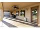 Covered patio with ceiling fans, a table and chairs, and backyard access at 3927 E Vista Grande --, San Tan Valley, AZ 85140