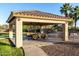 Inviting covered patio featuring ample seating and ceiling fans, set in a well-maintained outdoor space with playground at 3927 E Vista Grande --, San Tan Valley, AZ 85140