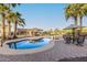 Inviting pool with a spa and a poolside lounge area, enhanced by towering palm trees on a sunny day at 3927 E Vista Grande --, San Tan Valley, AZ 85140